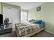 Comfortable bedroom with carpet flooring, neutral tones, closet, and bright window at 1249 Mazarion Pl, Trinity, FL 34655