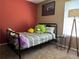 Cozy ' bedroom with plush carpeting, a window letting in natural light, and an accent wall at 1249 Mazarion Pl, Trinity, FL 34655