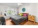 Bedroom featuring hardwood floors, a window view, and a ceiling fan at 1249 Mazarion Pl, Trinity, FL 34655