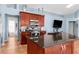 Modern kitchen with stainless steel appliances, granite countertops, and ample cabinet space at 1249 Mazarion Pl, Trinity, FL 34655