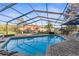 Relaxing screened-in pool area with brick pavers and an outdoor dining space at 1249 Mazarion Pl, Trinity, FL 34655