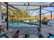 Relax by the pool in this screened in lanai with lush backyard at 1249 Mazarion Pl, Trinity, FL 34655