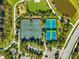 Aerial view of tennis and pickleball courts, playground, and walking paths at 13022 Payton St, Odessa, FL 33556