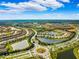 Aerial view of a large residential community with lakes and green spaces at 13022 Payton St, Odessa, FL 33556