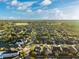 Community overview featuring houses, lakes, and lush greenery at 13022 Payton St, Odessa, FL 33556