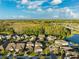 Community overview featuring houses, lakes, and lush greenery at 13022 Payton St, Odessa, FL 33556