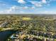Community overview featuring houses, lakes, and lush greenery at 13022 Payton St, Odessa, FL 33556