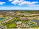 Community overview featuring a pool, clubhouse, tennis courts, and residential homes at 13022 Payton St, Odessa, FL 33556
