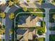 Aerial view of homes with a focus on two houses and their yards at 13022 Payton St, Odessa, FL 33556