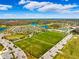 Aerial view of baseball and soccer fields, parking, and nearby lake at 13022 Payton St, Odessa, FL 33556