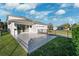 Large backyard with patio, grassy area, and privacy fence at 13022 Payton St, Odessa, FL 33556