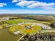 Aerial view of well-maintained baseball fields near a lake at 13022 Payton St, Odessa, FL 33556