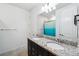 Bathroom boasts double sinks, granite countertops, and a teal shower curtain at 13022 Payton St, Odessa, FL 33556