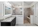 Bathroom with walk-in shower, granite vanity, and tile flooring at 13022 Payton St, Odessa, FL 33556