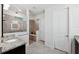 Bathroom with walk-in shower, granite vanity, and tile flooring at 13022 Payton St, Odessa, FL 33556