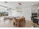 Light and bright dining area with wooden table and bench at 13022 Payton St, Odessa, FL 33556