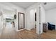Open entryway with a view into the living area and powder room at 13022 Payton St, Odessa, FL 33556