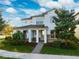 Two-story home with stone accents and a landscaped yard at 13022 Payton St, Odessa, FL 33556