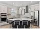 Modern kitchen with a large island and stainless steel appliances at 13022 Payton St, Odessa, FL 33556