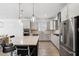 Modern kitchen with a large island and stainless steel appliances at 13022 Payton St, Odessa, FL 33556