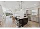 Open floor plan with kitchen island and living room at 13022 Payton St, Odessa, FL 33556
