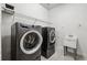 Laundry room with washer, dryer, and utility sink at 13022 Payton St, Odessa, FL 33556