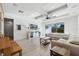 Spacious living room with large sectional sofa and backyard access at 13022 Payton St, Odessa, FL 33556