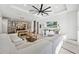 Open concept living room with sectional sofa and kitchen view at 13022 Payton St, Odessa, FL 33556