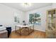 Home office with built-in shelving and large window at 13022 Payton St, Odessa, FL 33556
