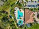 Resort-style pool with surrounding lounge areas and clubhouse at 13022 Payton St, Odessa, FL 33556