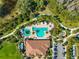 Resort-style pool with surrounding lounge areas and clubhouse at 13022 Payton St, Odessa, FL 33556