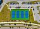 Aerial view of well-maintained tennis courts with ample parking at 13022 Payton St, Odessa, FL 33556