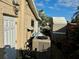 Backyard with shed, AC unit, and partially visible canal at 1354 Linstock Dr, Holiday, FL 34690