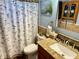 Bathroom with granite vanity and ocean-themed shower curtain at 1354 Linstock Dr, Holiday, FL 34690