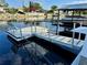 Floating dock with steps leading to the water at 1354 Linstock Dr, Holiday, FL 34690