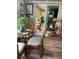 Cozy sunroom with rattan furniture, a glass table, and lots of natural light at 1354 Linstock Dr, Holiday, FL 34690
