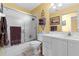 Clean bathroom with a shower/tub combo, white vanity, and neutral decor at 1400 Summerwood Ct, Spring Hill, FL 34606