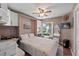 Bedroom with a queen bed, and access to a full bathroom at 1400 Summerwood Ct, Spring Hill, FL 34606