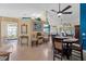 Open dining room with hardwood floors and a view into the living room at 1400 Summerwood Ct, Spring Hill, FL 34606