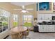Kitchen nook with white cabinets and garden views at 1400 Summerwood Ct, Spring Hill, FL 34606