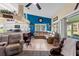 Spacious living room featuring a sectional sofa and view into the kitchen and dining areas at 1400 Summerwood Ct, Spring Hill, FL 34606