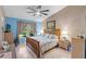 Comfortable main bedroom featuring a king-size bed and ample natural light at 1400 Summerwood Ct, Spring Hill, FL 34606