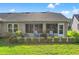Screened patio with seating area, perfect for relaxing outdoors at 1400 Summerwood Ct, Spring Hill, FL 34606