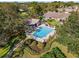 Community pool with patio and surrounding landscaping at 1400 Summerwood Ct, Spring Hill, FL 34606