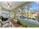 Bright sunroom offering picturesque views and a relaxing atmosphere at 1400 Summerwood Ct, Spring Hill, FL 34606