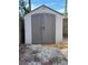 Exterior view of a large storage shed in the backyard at 1925 Patriot Ln, Holiday, FL 34690