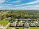 Aerial view of houses, roads, and green areas in a neighborhood at 19907 Tattnall Way, Brooksville, FL 34601