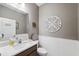 Powder room with decorative wall art and modern sink at 19907 Tattnall Way, Brooksville, FL 34601
