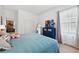 Comfortable bedroom featuring a large bed and calming decor at 19907 Tattnall Way, Brooksville, FL 34601