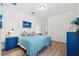 Spacious bedroom with light walls and blue accents at 19907 Tattnall Way, Brooksville, FL 34601